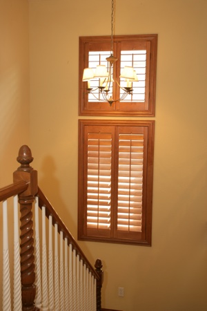 Ovation plantation shutters in tan staircase.